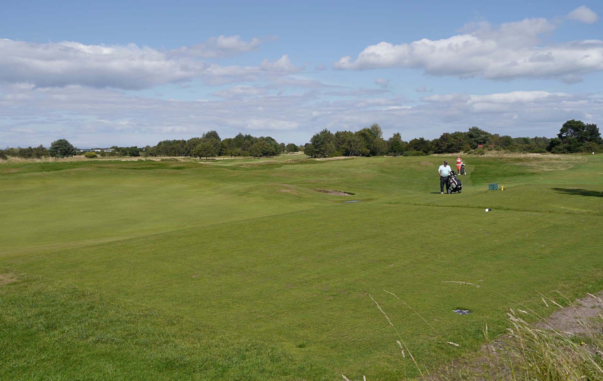 Golfers on the fairway at Nairn Dunbar
