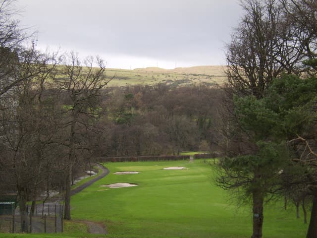 Greens and bunkers at Dalmuir, Clydebank's public course, with the Kilpatrick Hills behind