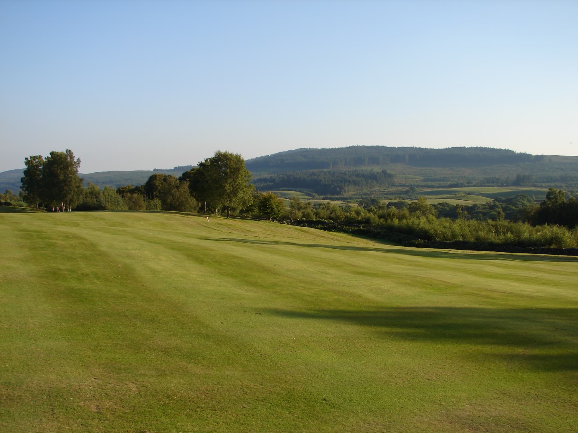 A fairway at New Galloway, with the Galloway hills beyond