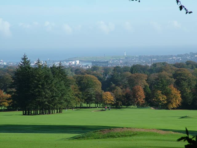 Hazlehead's parkland fairways with Aberdeen and the sea beyond